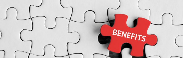 A red puzzle piece that says "benefits" on top of plain white puzzle pieces.
